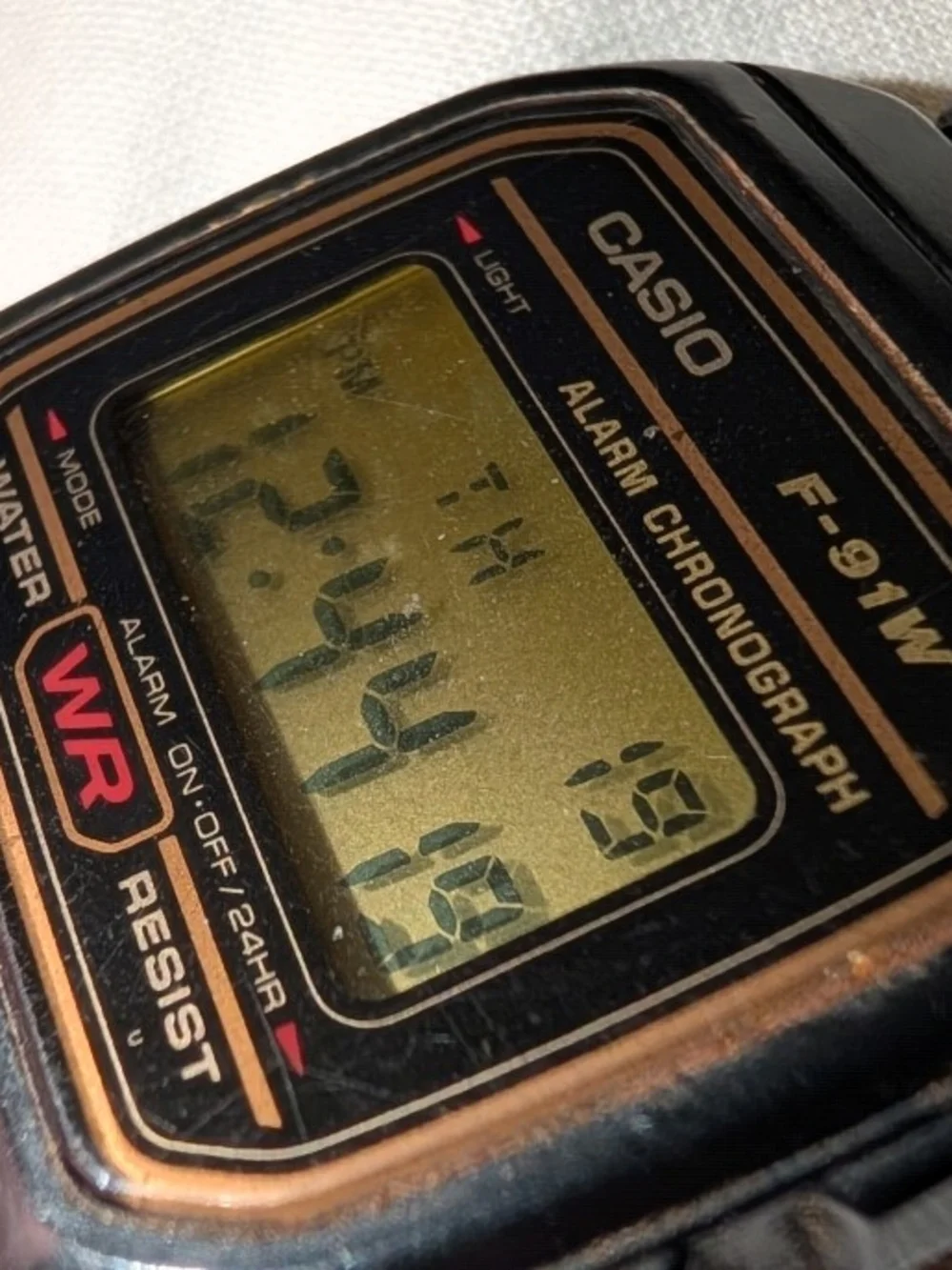 Working Mens Casio F-91W Digital Watch in Black with Gold Accents
